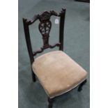 Edwardian mahogany nursing chair, with acanthus leaf and floral carved cresting rail, pierced