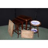 Nest of three mahogany occasional tables, the largest 48cm wide, circular table with blue and