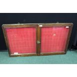 Mahogany wall hanging display cabinet, with two glazed doors and red fabric lined interior, 91.5cm