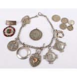 Silver watch chain set with six silver quoits prizes and a shield shaped pendant, 2.4oz, together