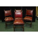 Set of four Cromwellian style dining chairs, with studded upholstered backs and seats, on carved