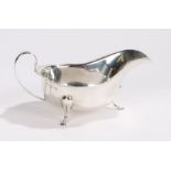 George V silver sauce boat, Sheffield 1931, maker Emile Viner, with loop handle, wavy rim, raised on