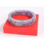 Lavender jade bangle, carved with fish and scrolls