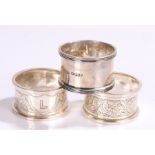 Pair of Edward VII silver napkin rings, Birmingham 1909, maker William Aitken, with foliate