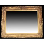 19th Century gilt gesso frame/mirror, of large proportions, the gilt gesso scroll and flower frame