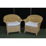 Pair of wicker armchairs with blue and white upholstered cushions (2)