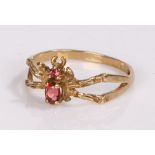 9 carat gold insect ring, with a spider to the head set with a purple stone, ring size O