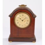 Edwardian mahogany and boxwood strung mantel clock the arched case with brass carrying handle, the