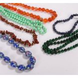 Necklaces, to include carnelian agate, green agate, porcelain bead necklace, jade type necklace