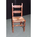 Oak dining chair, with scroll carved splat backs, rush seat, on turned legs and stretchers