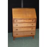 Mid 20th Century oak veneered bureau, the fall opening to reveal two small interior drawers,