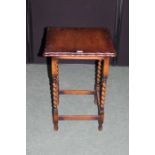 Edwradian oak table with gadrooned square top, on barley twist turned legs and flattened stretchers,