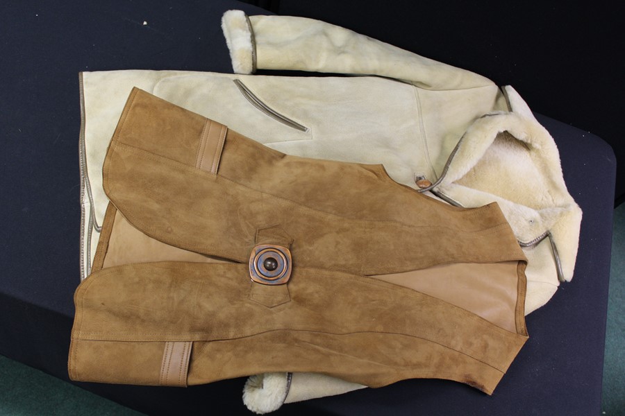 A sheepskin coat, together with a leather waistcoat, (2)