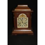 Edwardian mantel clock, the silvered dial with Roman numerals and gilt scroll and mask spandrels,