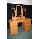Pine dressing table, the triple mirror above two small drawers, the base with three drawers to