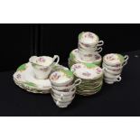 Paragon porcelain service, of twelve cups, twelve plates, four serving dishes and a milk jug, (qty)