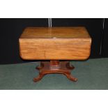 Regency mahogany breakfast table, the table top with rectangular drop leaves and frieze drawer, on a