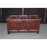 18th century and later oak coffer, with hinged lid above a triple panelled front, on block feet,