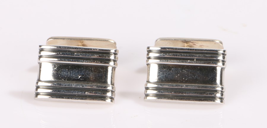 Pair of silver cufflinks, with line decoration