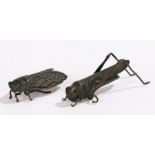 Two Japanese insect models, a locust with arched rear legs, 7.5cm long and a fly, 5cm long, (2)