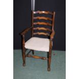 Ladder back elbow chair, with over stuffed seat, on turned legs and stretchers