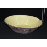 Large pottery bowl, with cream glazed interior, 55cm diameter