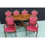 French style dining table and chairs, the table of quatrefoil form with foliate marquetry