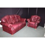 Brown leather three seater settee and matching armchair, with button back cushions, raised on