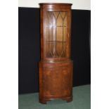 Walnut standing corner cupboard, the astragal glazed door above a bow front cupboard door, 66cm