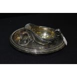 Pair of plated oval tureens and covers, with beaded borders and detachable handles, plated sauceboat