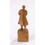 Republic of China carved figure, of a man walking raised on a rocky plinth base, 9.5cm high