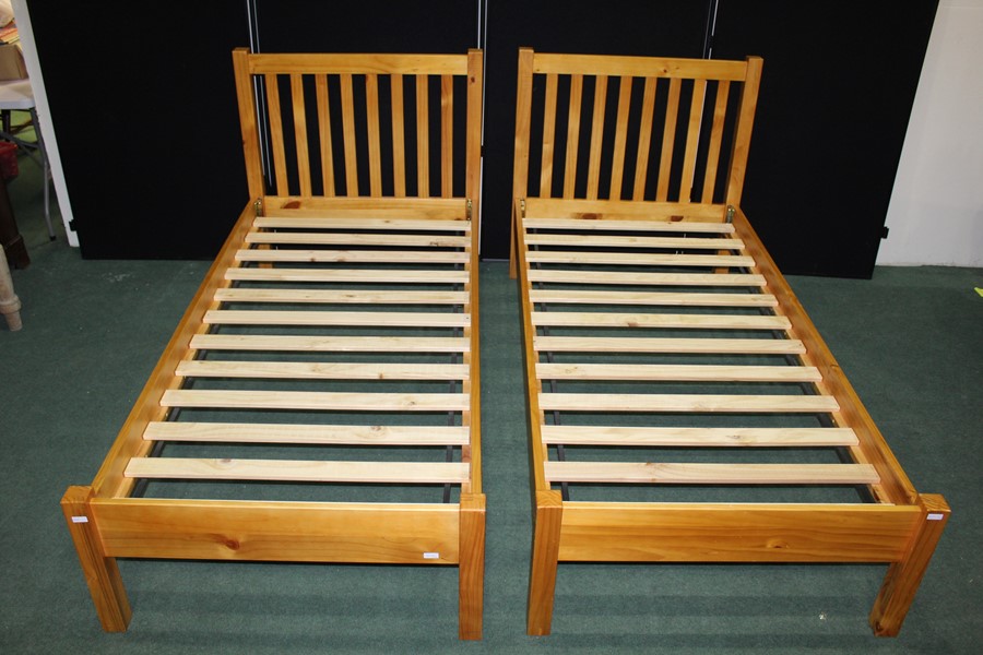 Pair of pine single beds, with railed head boards, 99cm wide