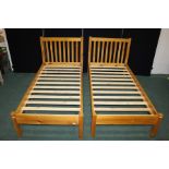 Pair of pine single beds, with railed head boards, 99cm wide