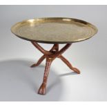 Middle Eastern brass tray on stand, the engraved figural tray top above a hardwood inlaid bone