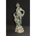 Spelter figure depicting a young boy wearing a hat and holding an umbrella, on a marble plinth base,