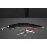 Large kukri and scabbard, small kukri and scabbard, kukri brooch, German cutthroat razor (4)