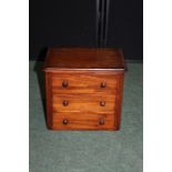 Small mahogany chest of three drawers, formerly part of a dressing table, 28cm wide