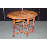 Georgian style oak drop-leaf table, on barley twist legs united by flattened stretchers, 91cm wide