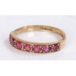 9 carat gold ring set with seven rubies to the head