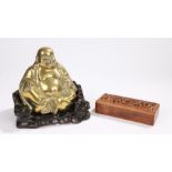 Meiji period brass figure of Hotei Buddha seated with bag of happiness, with red stone in his