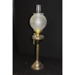 Duplex bras oil lamp, the frosted glass shade with etched foliate decoration, on a reeded stem and