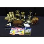 Two brass oil lamps, model of the Cutty Sark, wooden elephant, Thunderbirds toys, three cut throat