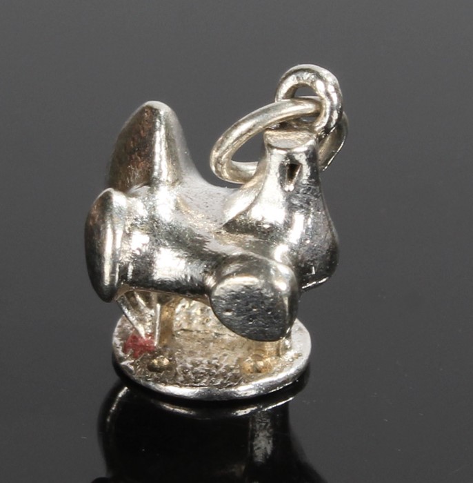 Henry Moore style charm, of an abstract figure, 11mm high