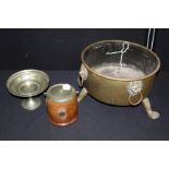 Brass jardiniere, with four lion mask handles, raised on three paw feet, plated tazza, plated and