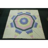 Modern needlework quilt with star design to the centre, 260cm x 260cm