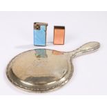 Silver handled hand mirror, blue enamel decorated cigarette lighter, puce enamel decorated