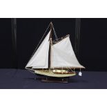 Model of a yacht, on a wooden plinth base, 72.5cm high