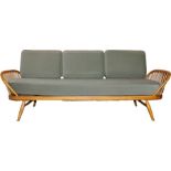 Ercol elm day bed/studio sofa, with removable back, pierced railed ends, three loose cushions and