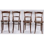 Set of four Mundus bentwood chairs, with curved cresting rails and splat backs, scroll and