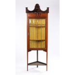 Edwardian mahogany and boxwood strung standing corner cupboard, with down swept pediment above a